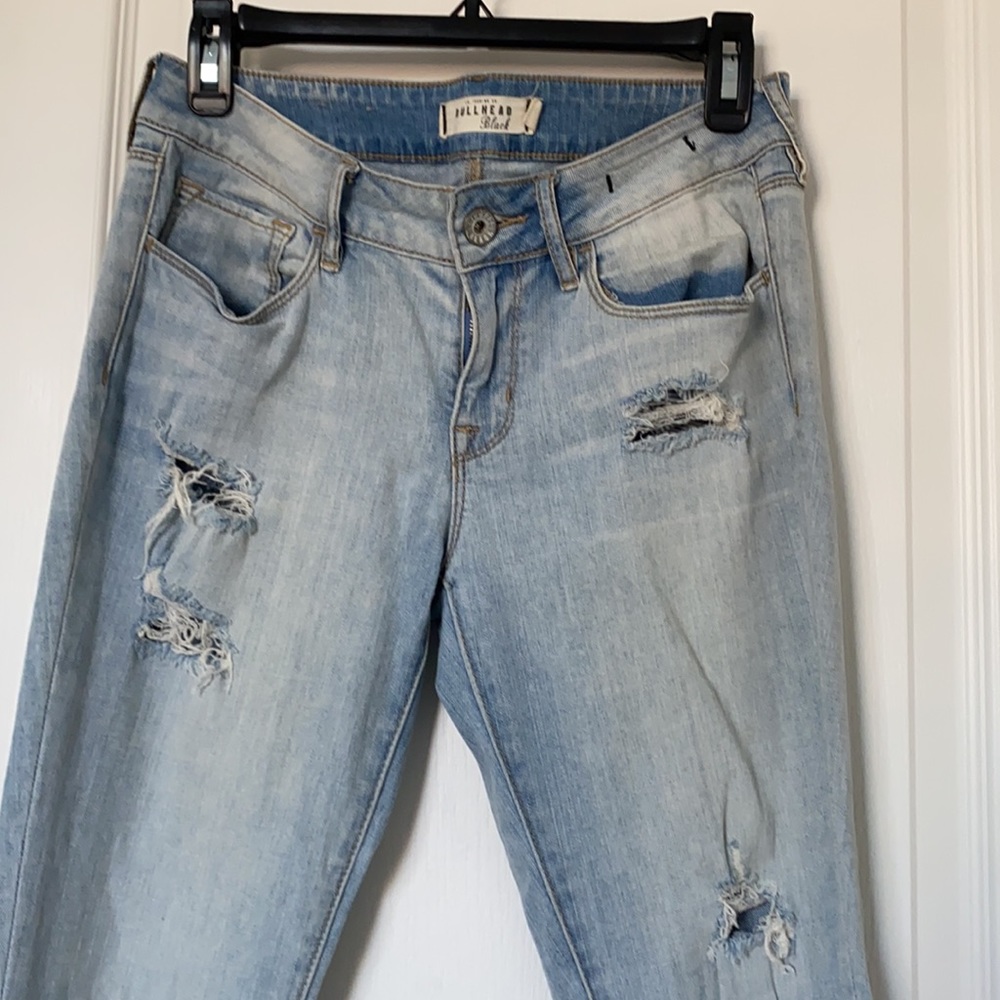 Women’s light blue jeans with holes